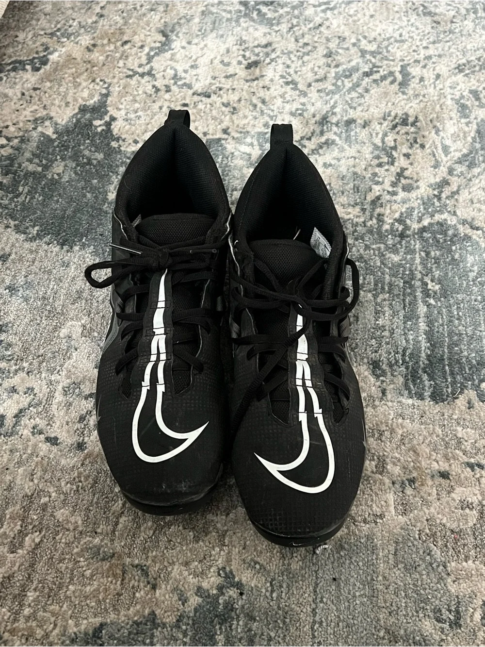 Nike Black Football Cleats with White Swoosh Accents